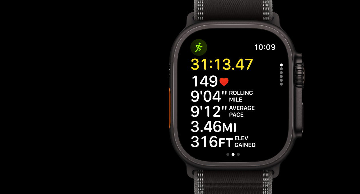 Apple Watch Ultra 3, black color, titanium case, Workout app, Outdoor Run, left side exterior, Action button, right side exterior, Digital Crown, side button, band, Trail Loop, black/charcoal color